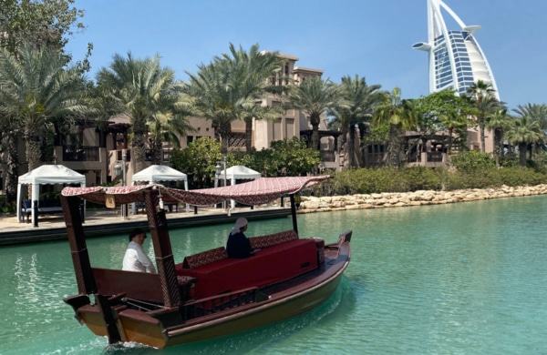 Abra or water taxi in front of the Burj Al Arab in Jumeirah Medinat